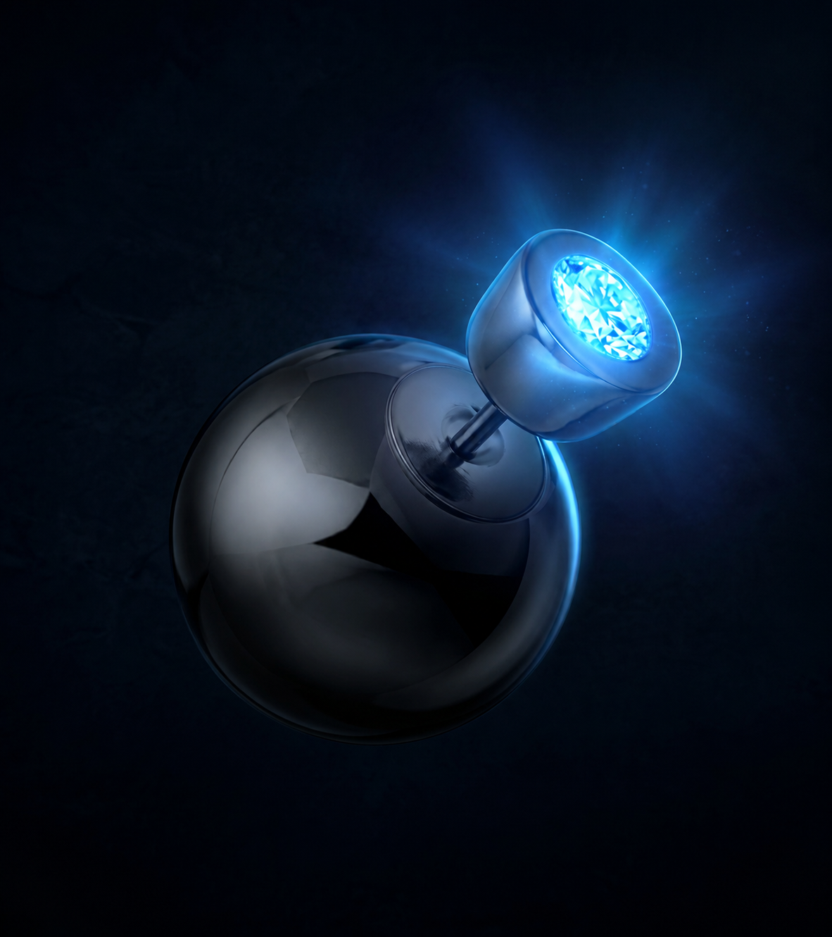 Fire and Fly earring — a polished sphere with a diamond glowing electric blue in the darkness